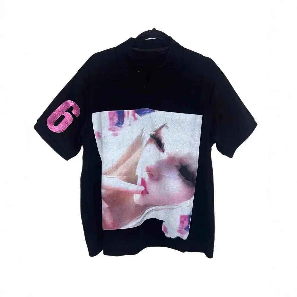 Men's short-sleeved printed polo shirt in a solid colour on a model.
