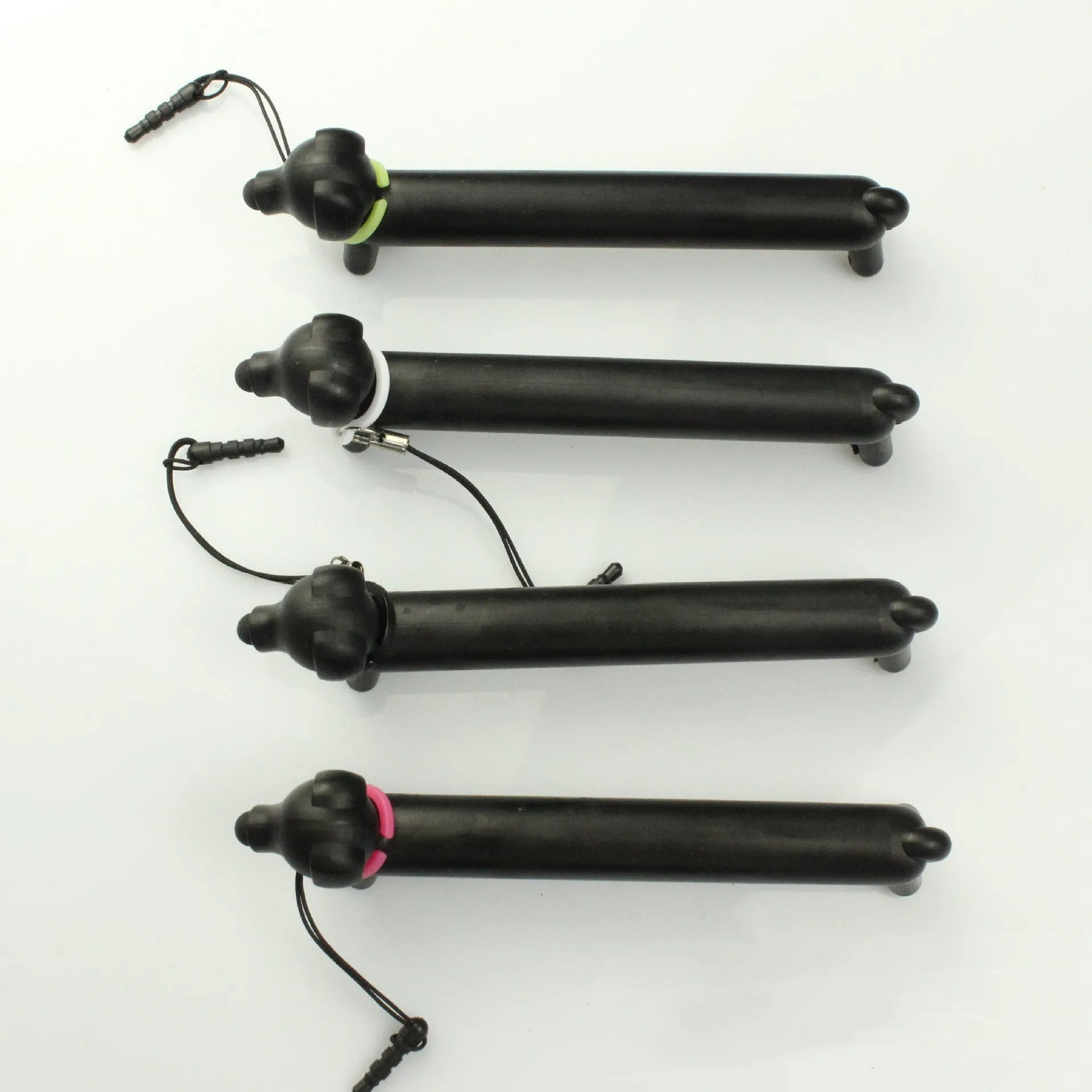 Black dog shaped touch screen pen with extendable length on white background