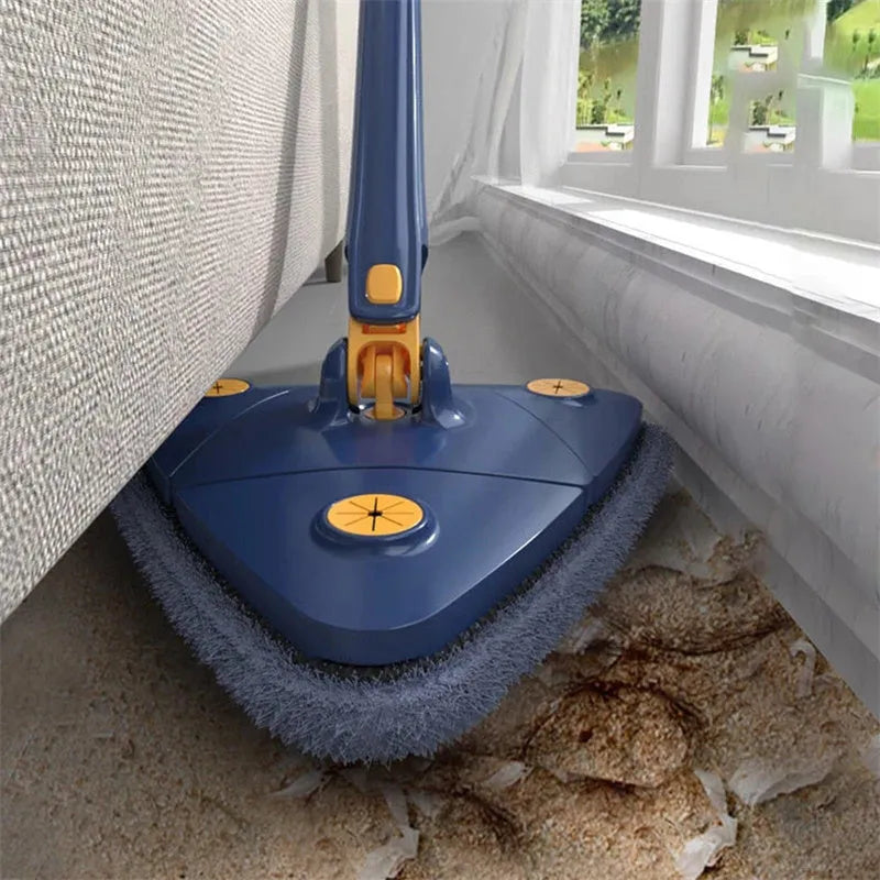 Blue extendable triangle cleaning mop with rotating head and long stainless steel pole on a tiled floor.