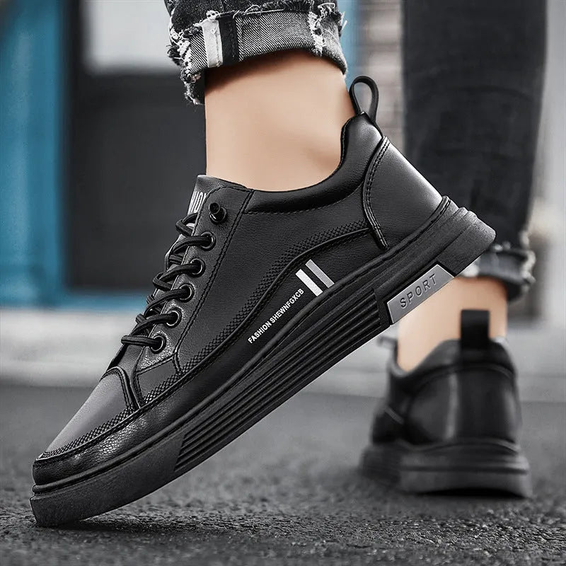 Men's black and white low-top skate shoes with elastic band fastening and rubber sole.