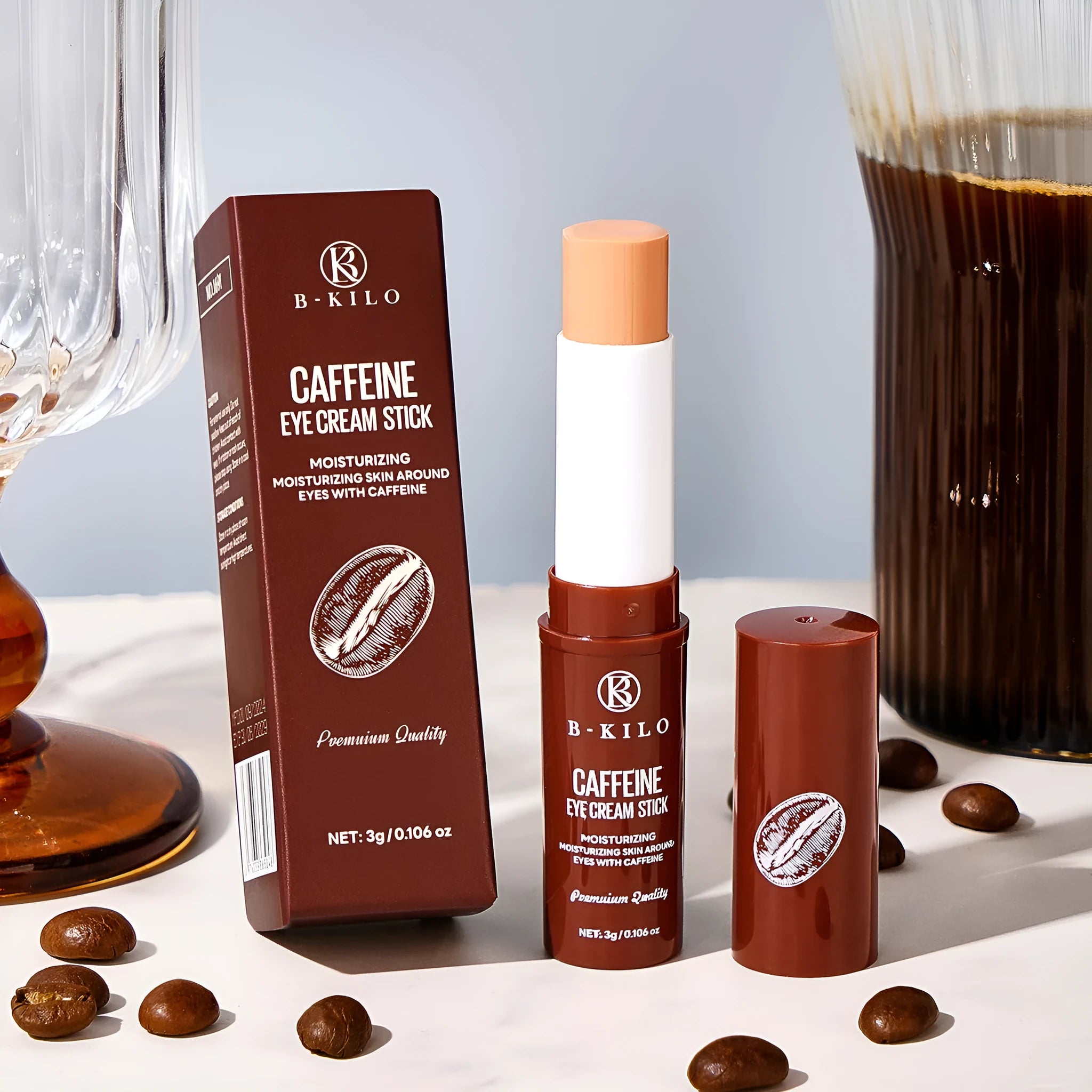 Caffeine eye cream stick in silver and white packaging, showing the 3g applicator for under-eye use.