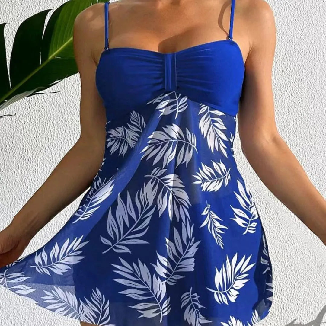 Women's high waist mesh swim briefs in black, blue, and peacock green on a mannequin.