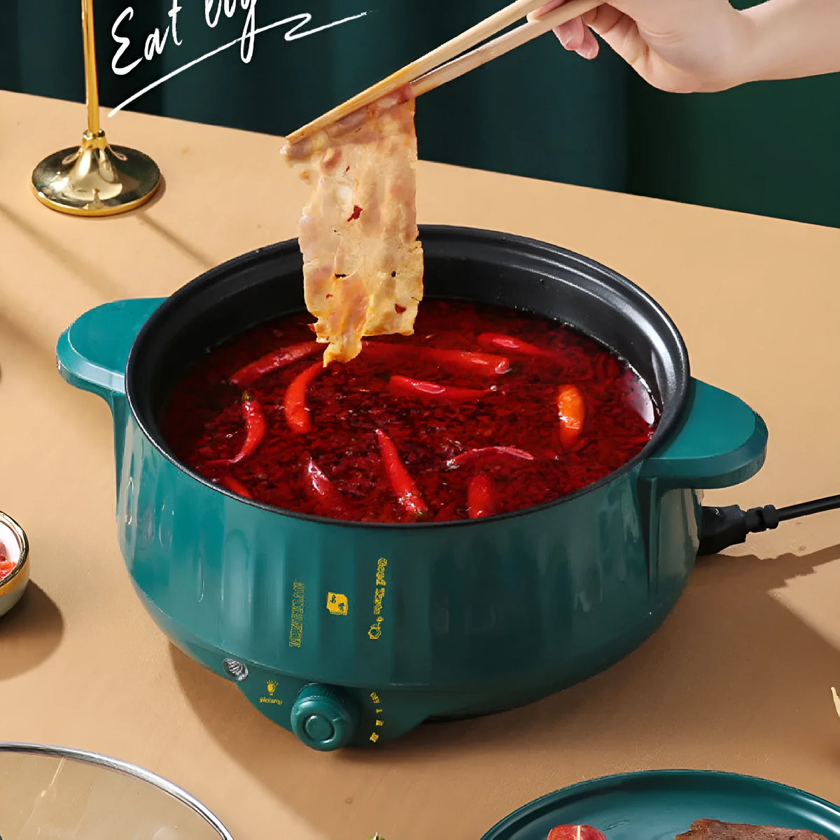 Stainless steel electric cooking pot with non-stick interior and integrated heating element