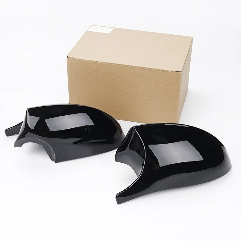 Pair of black ABS plastic rearview mirror housing shells for BMW 3 Series E90.