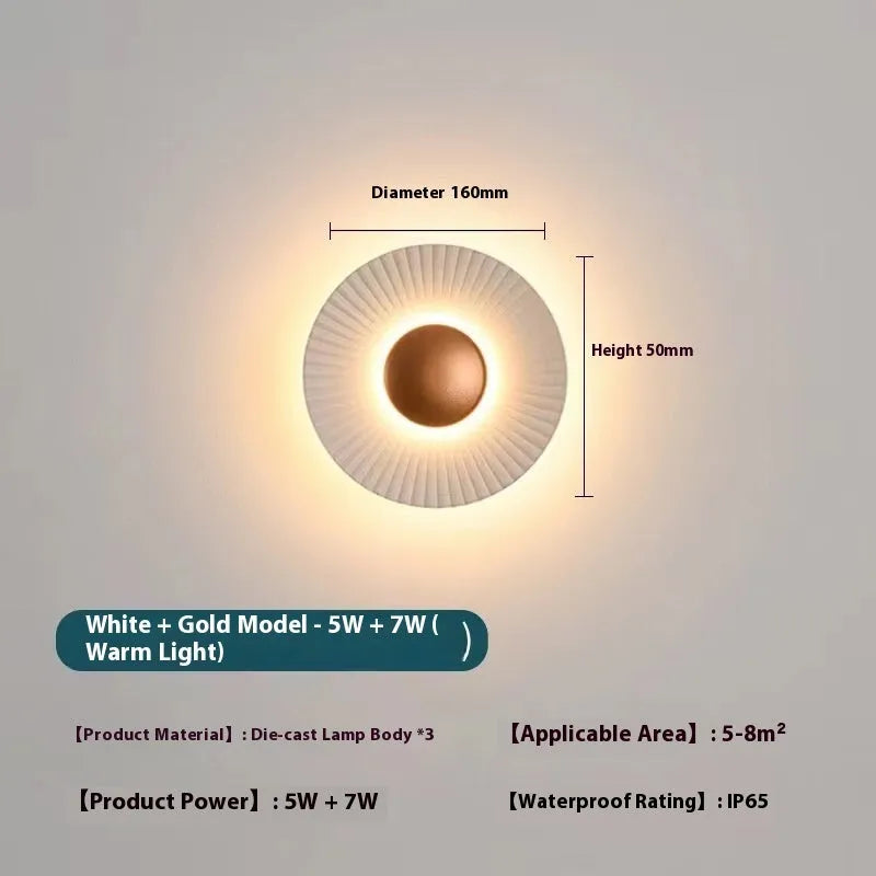 Round aluminium wall lamp with white and gold colour options mounted on wall
