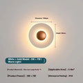 Round aluminium wall lamp with white and gold colour options mounted on wall