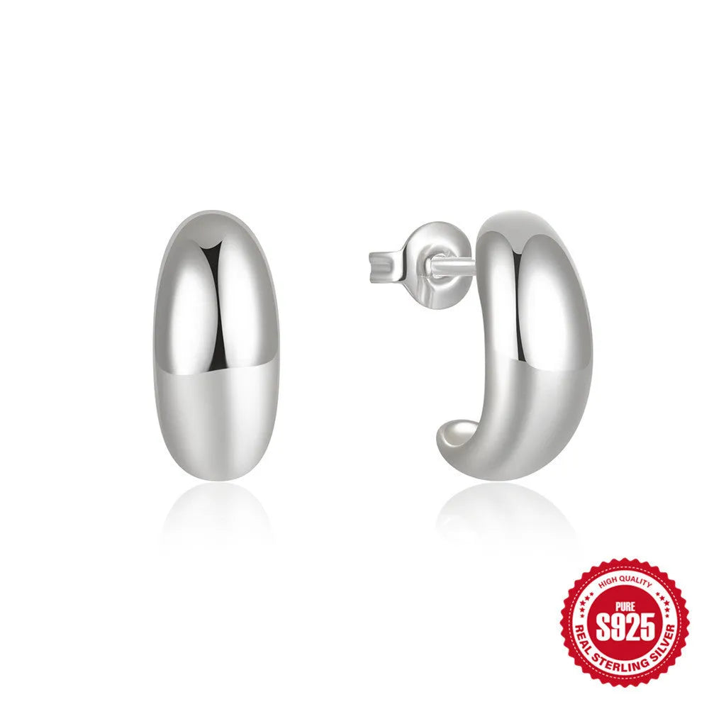 Sterling silver C-shaped stud earrings with glossy electroplated finish in geometric ring design