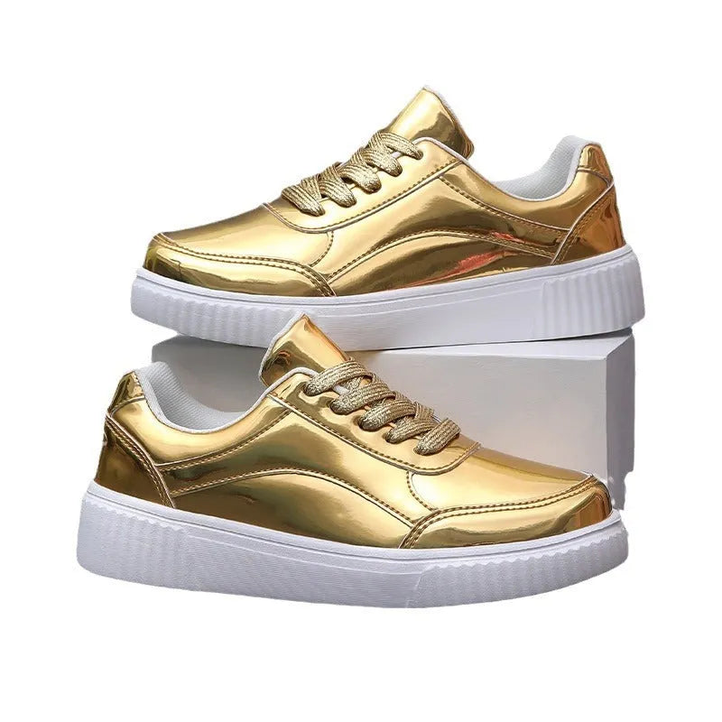 Gold platform sneaker with sequin upper and thick MD sole on a white background.