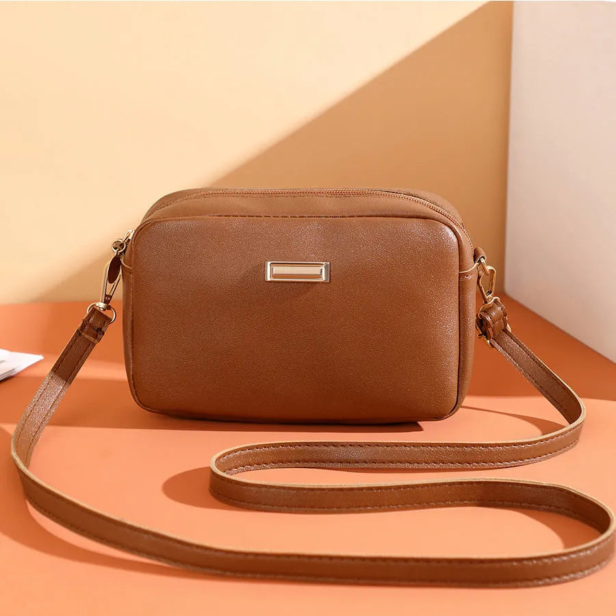 Solid colour women's PU shoulder bag with three-dimensional pockets in urban simplicity style