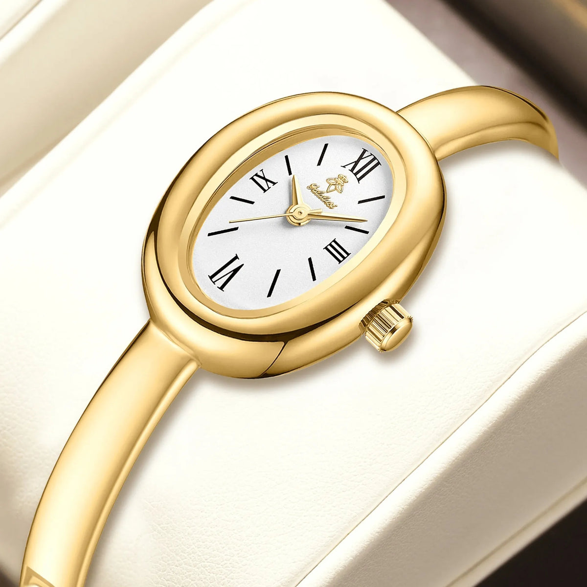 Women's oval retro quartz watch in gold colour with spiral pattern dial, showing 8mm thickness